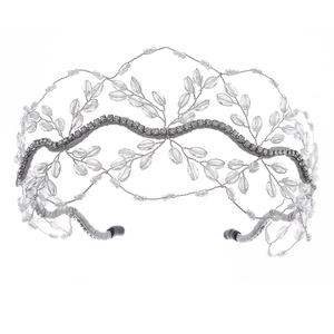 Detail showing elegant wave-shaped silver wire bridal headband with crystal beads