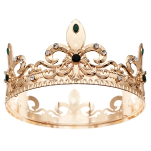 Vintage gold baroque crown with green gemstones and rhinestones for men on white background