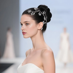 Detail of silver bridal hair vine with sparkling marquise rhinestones on elegant updo