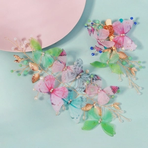 Ensemble serre-tête papillon féerique avec ailes en tulle et perles sur fond bleu clair