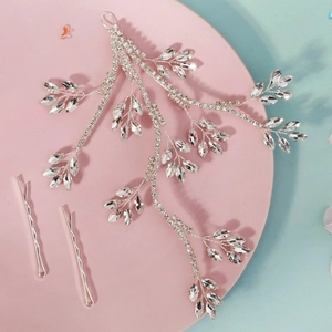 Exquisite rhinestone leaf bridal headpiece with silver wave hair clips set on pink tray