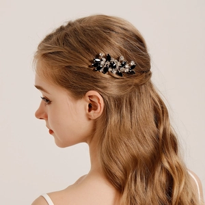 Elegant crystal hair comb with black rhinestones for wedding hairstyles on a model