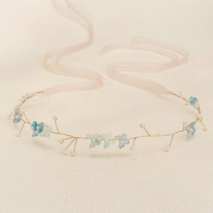 Elegant butterfly bridal headband with blue wings, pearls and pink silk ribbons