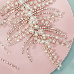 Detail of handcrafted bridal headband with pearls, rhinestones and silver leaf beadwork