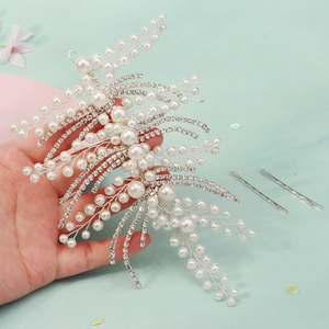 Detailed close-up of handmade bridal headband with white pearls and silver leaf crystals