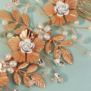 Luxurious rose gold floral hair comb with pearls and crystals for bridal hair styling