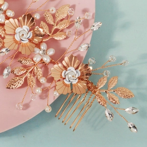 Detailed macro view of handmade wire-wrapped floral bridal comb with white pearls and crystals