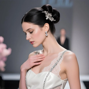 Detailed view of luxury rhinestone leaf bridal hair comb sparkling on a wedding bun