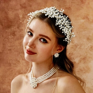 Detailed view of handmade luxury pearl bridal headband and multi-layer necklace set