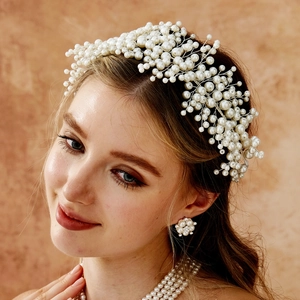 Elegant bridal pearl headband and floral earrings set with handmade beaded craftsmanship