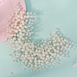 Detailed view of handcrafted pearl bridal headband with intricate silver wire weaving