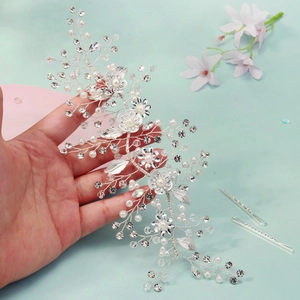 Silver bridal headband featuring handmade metal leaves, pearls and crystal rhinestones
