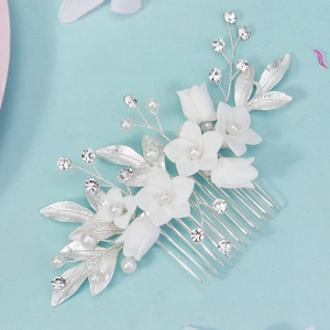 Elegant silver bridal hair comb with white resin flowers, sparkling rhinestones and pearls