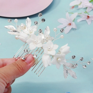 Handmade bridal hair comb with white ceramic flowers, pearls and crystals on silver base