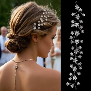 Macro detail of bridal hair vine with sparkling crystals and pearls on elegant hair