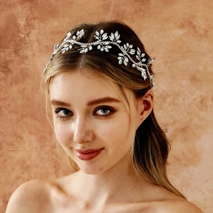 Detailed view of silver bridal headband featuring marquise rhinestones on a model