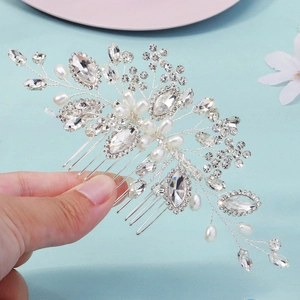Detail of handcrafted bridal hair comb with silver wire flowers and clear crystals