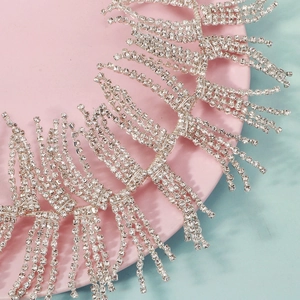 Macro detail of bridal rhinestone headband with long tassels and sparkling silver fringe