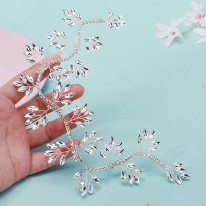 Handmade bridal hairpiece with silver vine design and navette rhinestones for weddings