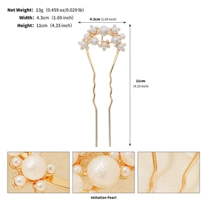 Detail view of gold U-shaped hair pin with imitation pearls showing dimensions and weight