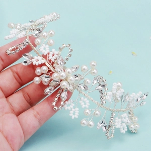 Handmade bridal hair vine with white pearls and sparkling rhinestones for wedding styling