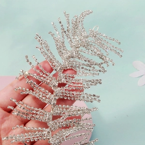 Luxurious handmade bridal headband with silver tassels and sparkling rhinestones