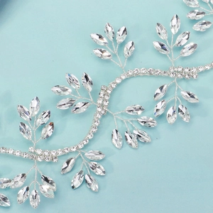 Silver bridal headband vine with marquise crystal leaves on a soft blue background