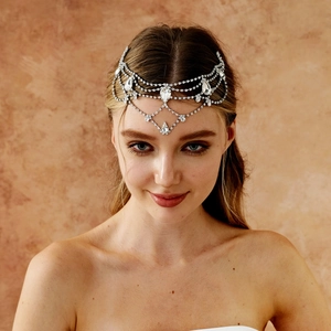 Exotic silver bridal forehead chain with rhinestone teardrop pendants on model