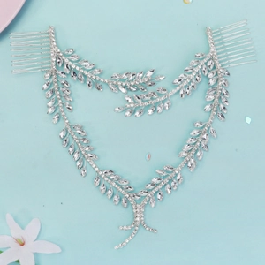 Close-up of a silver rhinestone bridal hair chain with leaf design and hair combs