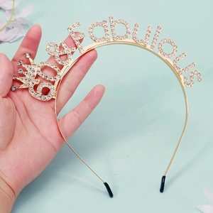 Detailed macro view of 60 & Fabulous gold headband with sparkling rhinestones for party