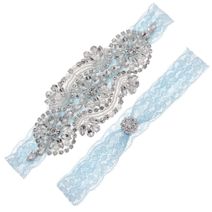 Exquisite bridal garter set with light blue lace, hand-sewn rhinestones, and pearls
