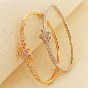 Elegant gold and silver turtle open cuff bracelets with sparkling pavé cubic zirconia