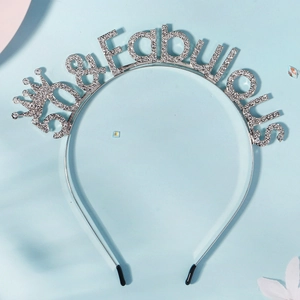 Detail of silver 50 and Fabulous headband with sparkling rhinestones and crown