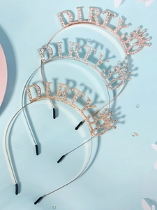 Detailed close-up of three glittery DIRTY letter headbands in rose gold, silver and gold finish