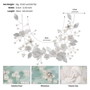 Detail of bridal headband showing white clay flowers, silver leaves and pearl accents