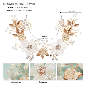 Detail view of bridal hair comb with white shell flowers, rhinestones and golden leaves
