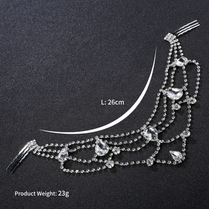 Detail view of silver rhinestone hair chain with pear-cut crystals and metal combs