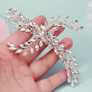 Close-up of silver bridal hair clip with marquise rhinestones in a leaf-shaped design