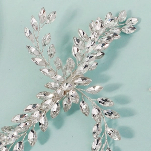 Elegant bridal hair clip with silver crystal branch and marquise rhinestone details