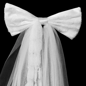 Elegant white bridal veil with satin bow and 3D lace flower details on soft tulle