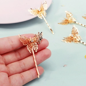 Golden butterfly hair clip with hollow filigree craft and rhinestone for Chinese wedding