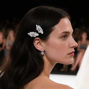 Elegant leaf zircon hair clips and earrings set worn by a model in a high-fashion portrait