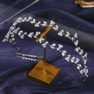 Luxury bridal zirconia headband with silver leaf and flower motifs on dreamlike starry background