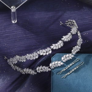 Detail view of silver zircon bridal leaf headband and matching hairpins on purple silk