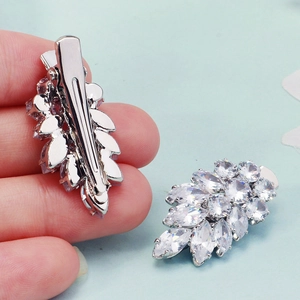 Elegant silver leaf hair clips with clear marquette-cut zircons for stylish dates
