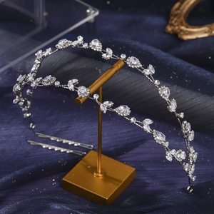 Elegant silver bridal tiara with sparkling zircon stones on a blue starry background