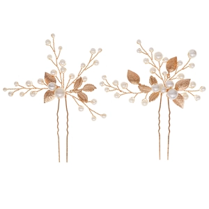 Elegant bridal hair pins set with golden leaves and pearls for wedding styling