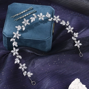 Macro detail of bridal silver flower hair vine with sparkling crystals and hair clips