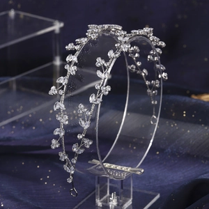 Close-up of silver bridal headband featuring intricate zircon floral and leaf patterns