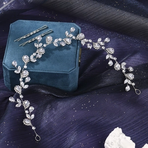 Detailed macro view of crystal vine headband with marquise stones and silver leaf design